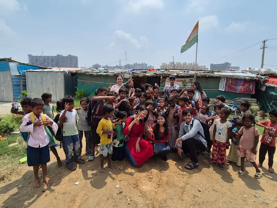 Children and the team outside the centre at the end of a session.